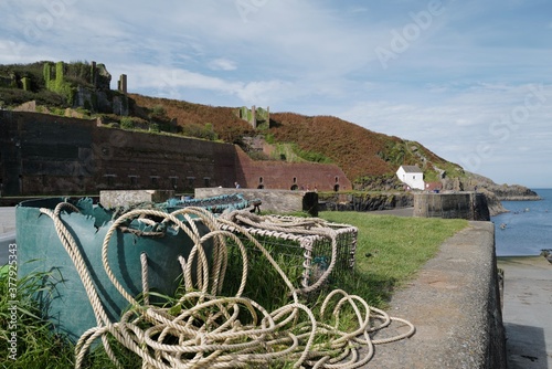 Porthgain harbour with fishing nets and lobster pots photo