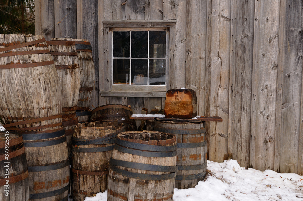 Old barrels outside the cooperage in winter at Pioneer Village Old barrels outside the cooperage in winter at Pioneer Village