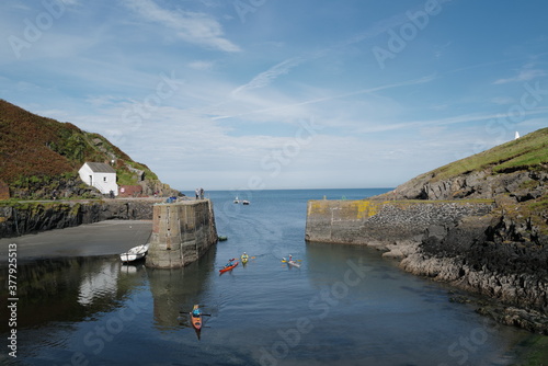 Porthgain harbour with kayak's coming home