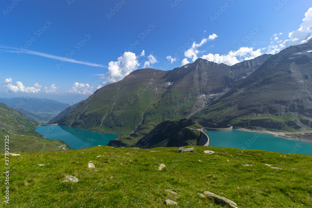 Beautiful view of high mountain lake near Kaprun.Hike to the Mooserboden dam in Austrian Alps.Quiet relaxation in nature.Wonderful nature landscape,turquoise tranquil lake,holiday travel scene Beautiful view of high mountain lake near Kaprun.Hike to the Mooserboden dam in Austrian Alps.Quiet relaxation in nature.Wonderful nature landscape,turquoise tranquil lake,holiday travel scene