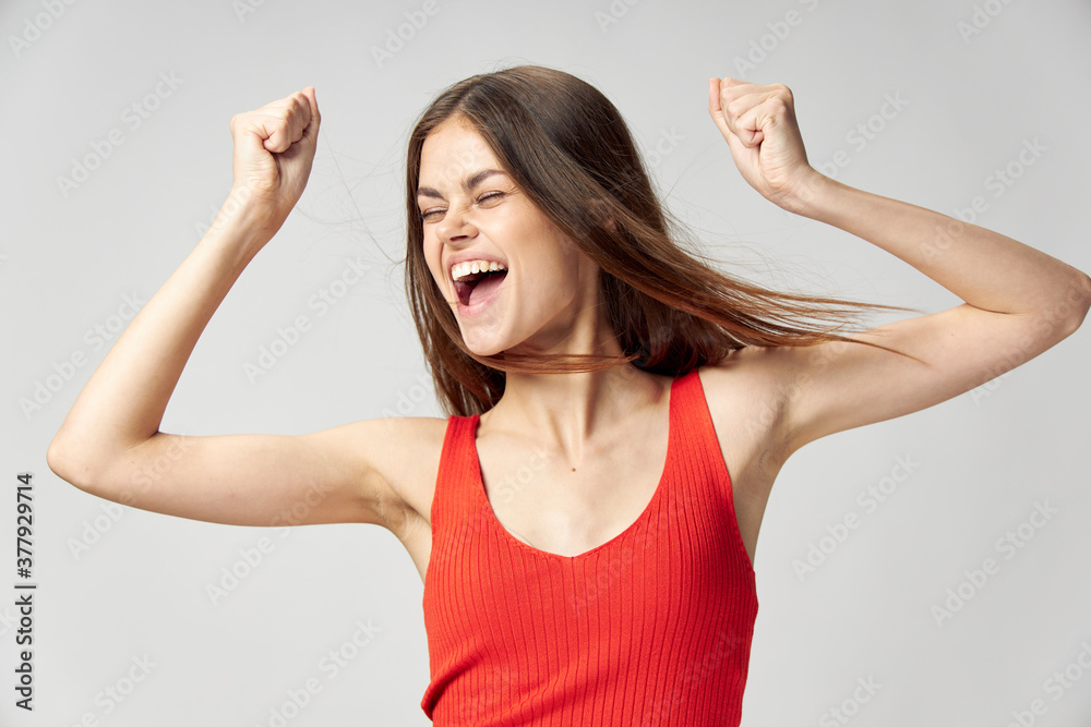 Woman holding hands in front of her emotions open mouth white t-shirt cropped view Woman holding hands in front of her emotions open mouth white t-shirt cropped view