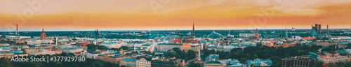 Riga, Latvia. Aerial View Panorama Cityscape At Sunset. TV Tower, Academy Of Sciences, St. Peter's Church, Boulevard Of Freedom, National Library, Dome Cathedral, Basilica Of St. James © Grigory Bruev