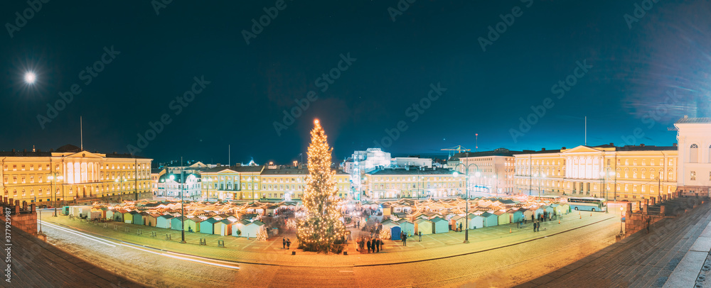 Helsinki, Finland. Christmas Xmas Market With Christmas Tree On Senate Square In Evening Night Illuminations. Panorama, panoramic view