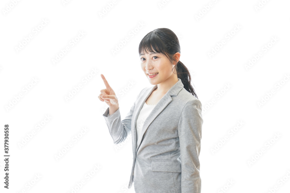 おすすめを指差す笑顔のビジネスウーマン おすすめを指差す笑顔のビジネスウーマン