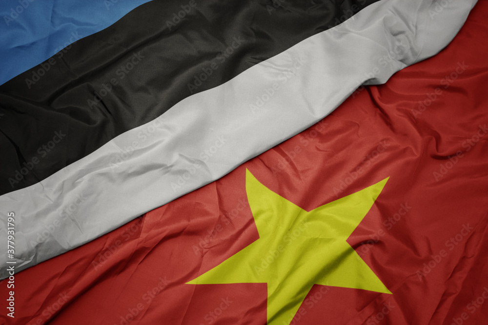 waving colorful flag of vietnam and national flag of estonia. waving colorful flag of vietnam and national flag of estonia.