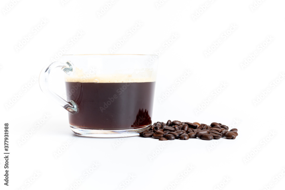 Fototapeta premium A glass of coffee grinder with coffee beans on white background