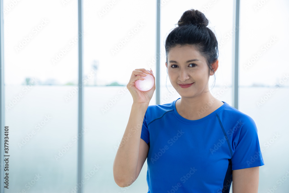 Beautiful women holding yoga equipment for pose meditation in the office. Healthy body posture with happy feeling in the morning. Sport concept. Beautiful women holding yoga equipment for pose meditation in the office. Healthy body posture with happy feeling in the morning. Sport concept.