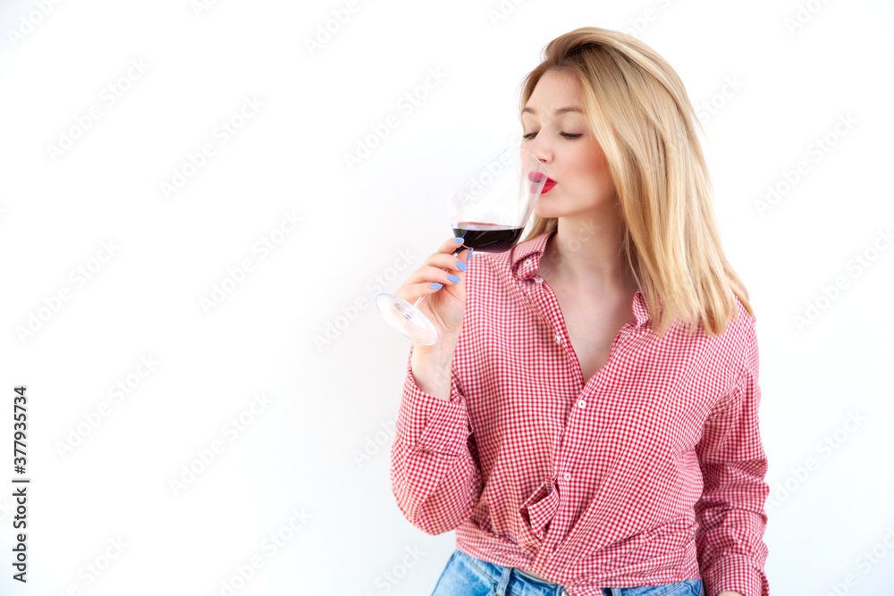 Young beautiful woman holding red wine glass on white background Young beautiful woman holding red wine glass on white background