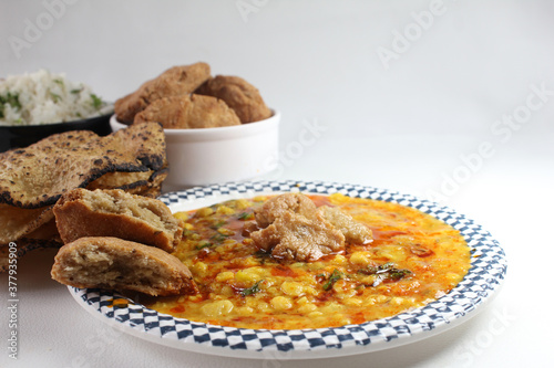 Traditional Rajasthani food Daal Bati Churma.made with wheat flour and served with tadke wali dal. photo