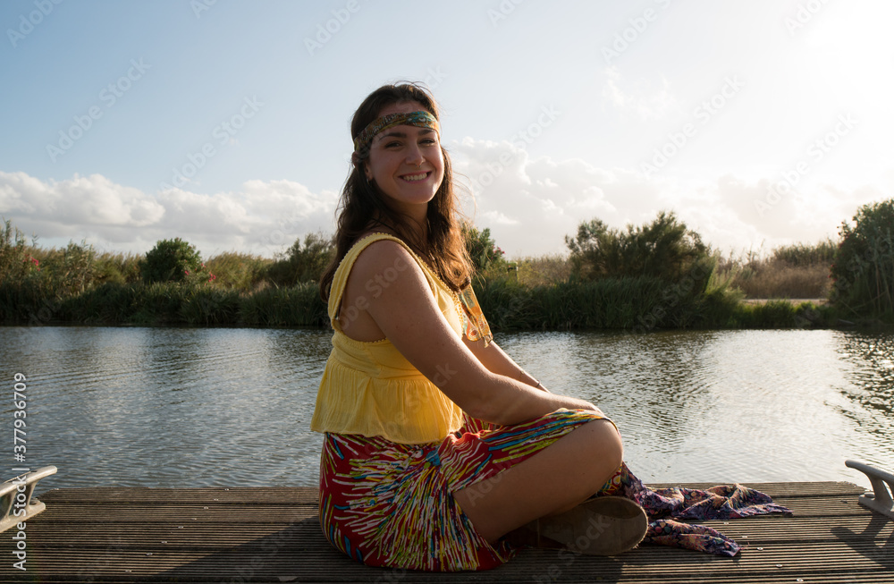 Hippie woman posing in the harbor