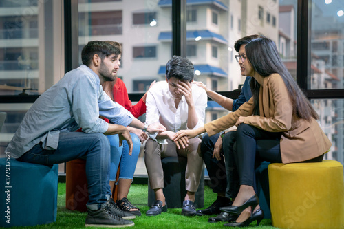 Employees feel stressed about making projects mistakes, A group of colleagues encouraged and consoled.