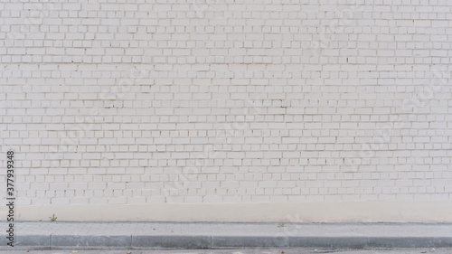 soft light white brick wall facade exterior at city street outdoor