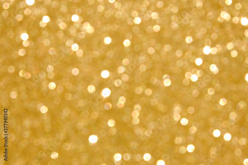 Abstract defocused background with golden bokeh lights. Celebration  Christmas concept.