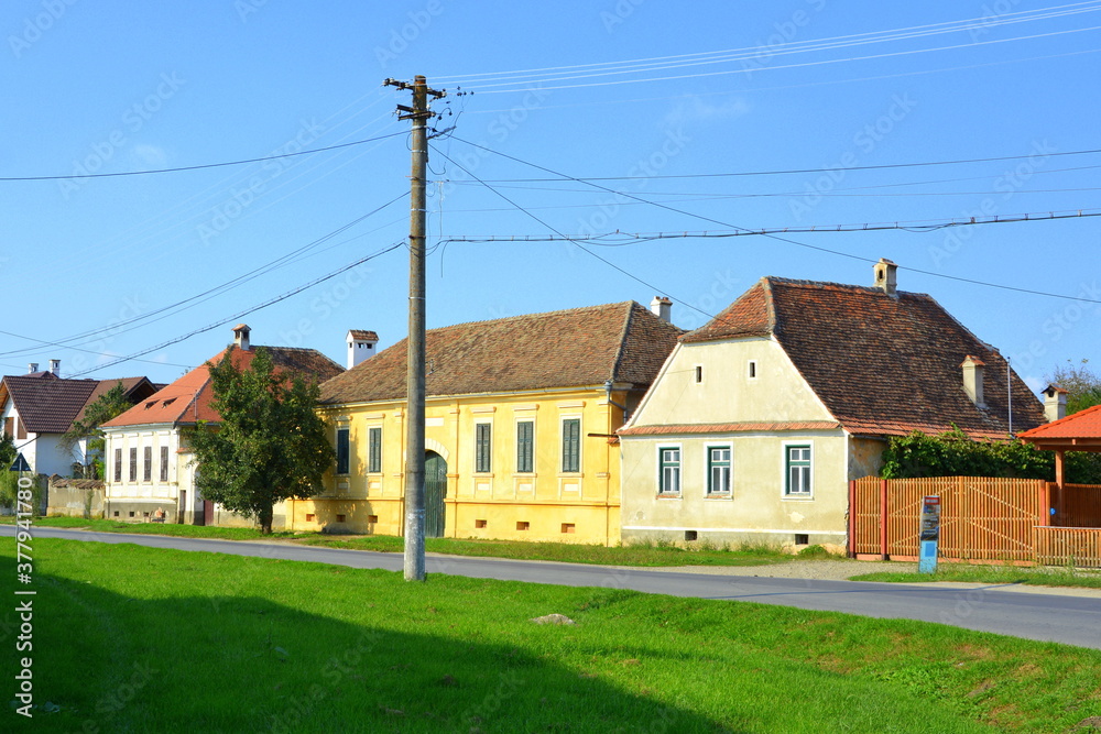 Typical rural landscape and peasant houses in  the village Cincsor, Kleinschenk, Transylvania, Romania. The settlement was founded by the Saxon colonists in the middle of the 12th century