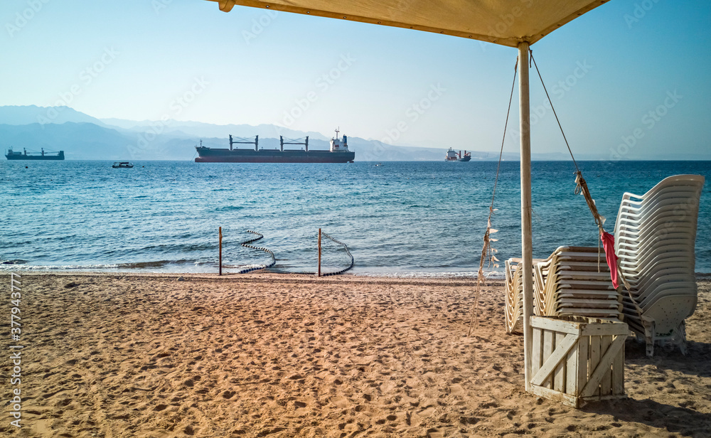 Obraz premium Sunny morning and safety swimming at sandy beach of the Red Sea, Middle East,