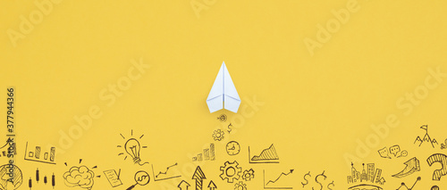 Business success, innovation and solution concept, Paper plane and business strategy on yellow background