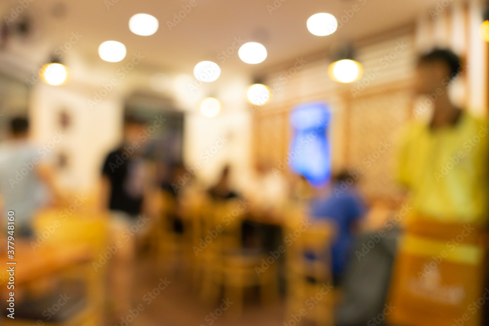 Blurred background of Vietnamese restaurant with people.