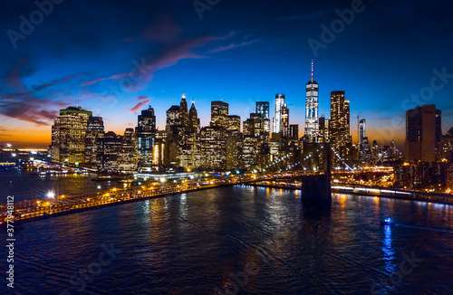 Aerial view of Brooklyn bridge and skyline at night