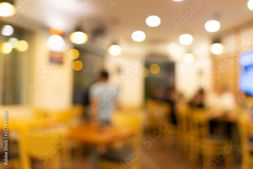 Blurred background of Vietnamese restaurant with people.