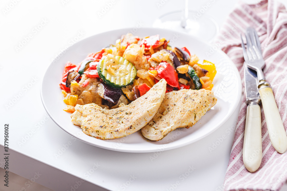 Grilled vegetables and fried chicken breast