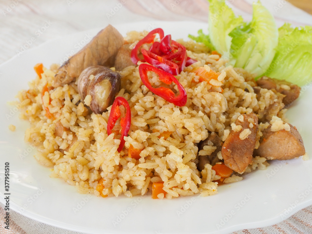 plate with pilaf, hot pepper and herbs. national cuisine. Oriental food. plate with pilaf, hot pepper and herbs. national cuisine. Oriental food.