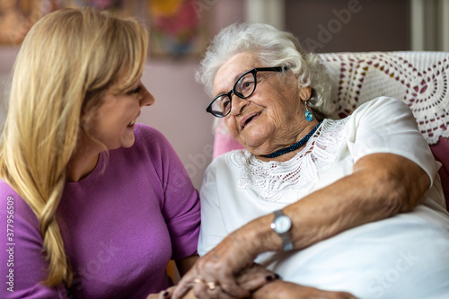 Photography Young woman spending time with her elderly grandmother at home