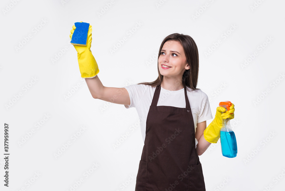 Young woman holding sponge and cleaning product on white background Young woman holding sponge and cleaning product on white background