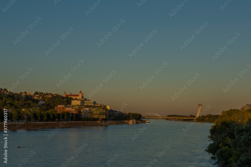 Bratislava capital in summer evening with color sunset and river Donau