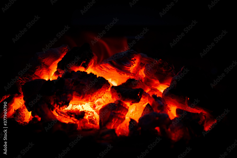 Incandescent charcoal embers with pretty orange tones Incandescent charcoal embers with pretty orange tones