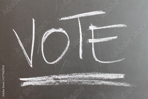 Vote written on a blackboard