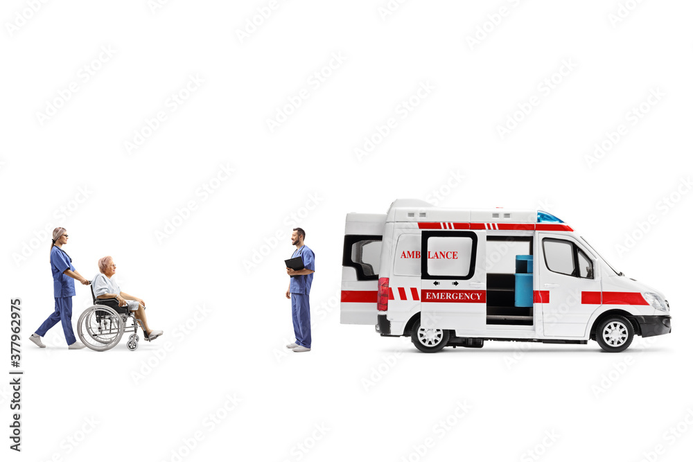 Nurse pushing an elderly patient in a wheelchair towards an ambulance