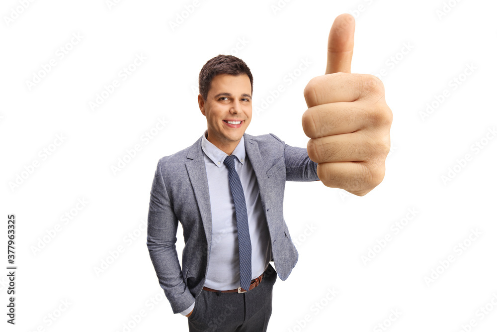 Professional young man showing thumbs up in front of the camera Professional young man showing thumbs up in front of the camera