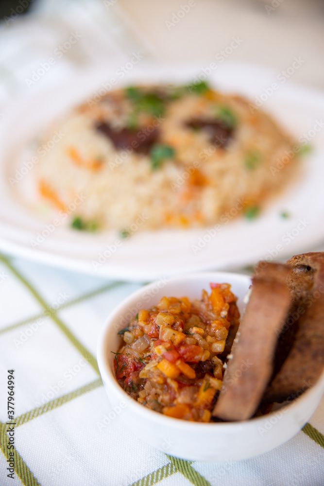 .pilaf and salad, black bread on the table .pilaf and salad, black bread on the table