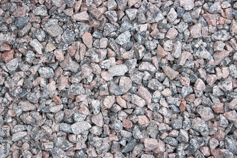 Background of red granite rubble of various sizes