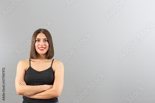 Young beautiful Turkish woman view in confident mood, isolated studio shot with copy space