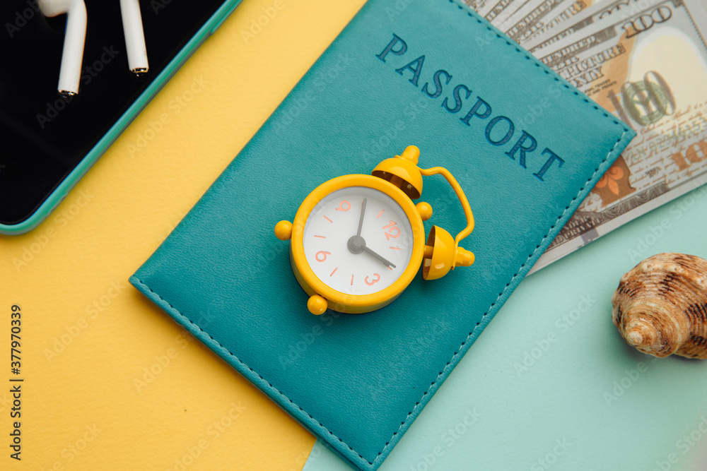 Outfit and accessories of traveler on yellow blue background close-up. Travel concept. Overhead view of traveler's accessories. Outfit and accessories of traveler on yellow blue background close-up. Travel concept. Overhead view of traveler's accessories.