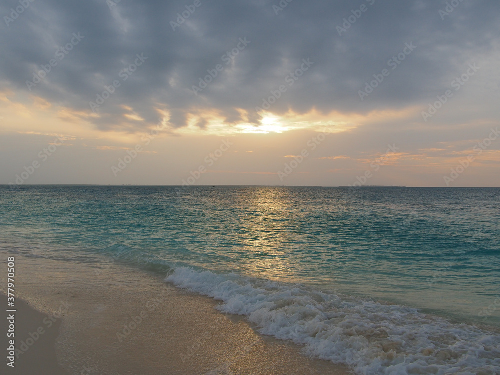 Sunset view above the water of the ocean in Zanzibar island, Tanzania. Copy space for text.
