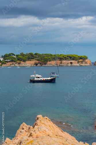 View of Sant Pol beach in the village of Sant Feliu de Guixols at Costa Brava in Catalonia, Spain photo