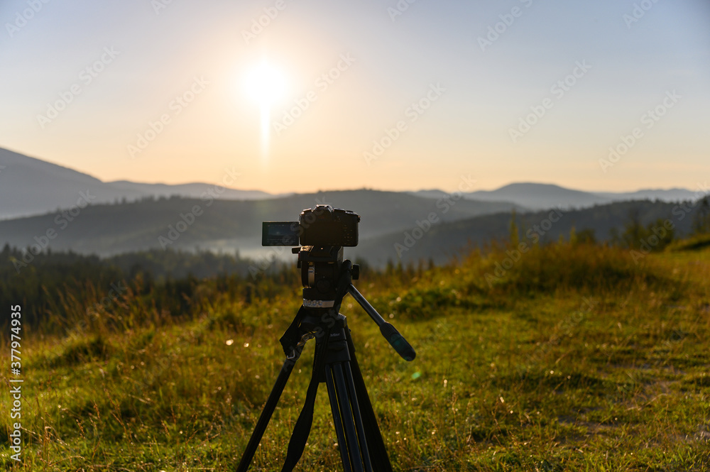  camera with tripod take photo on mountain beautiful view