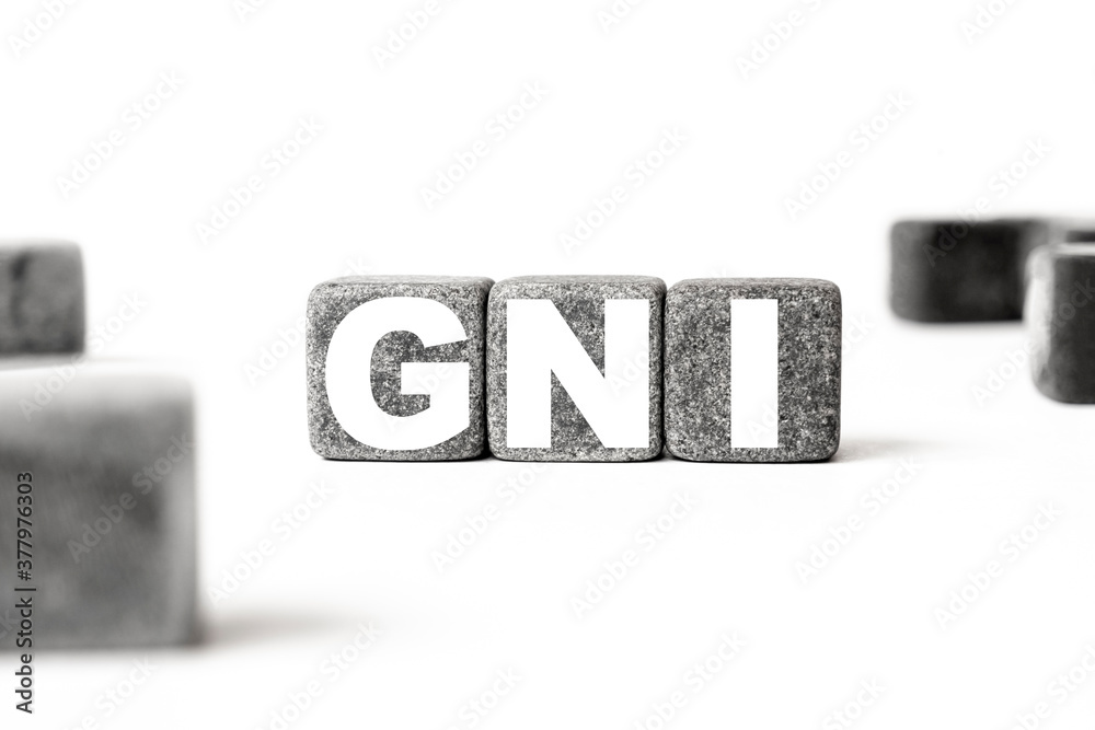 three stone cubes inscribed with the word GNI Gross national income among the cubes on a white background. Strong business concept three stone cubes inscribed with the word GNI Gross national income among the cubes on a white background. Strong business concept