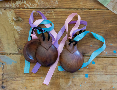 castanets with colored ties on the table