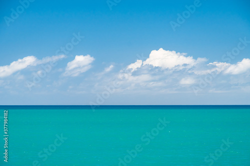 The ocean, the blue sky and white clouds