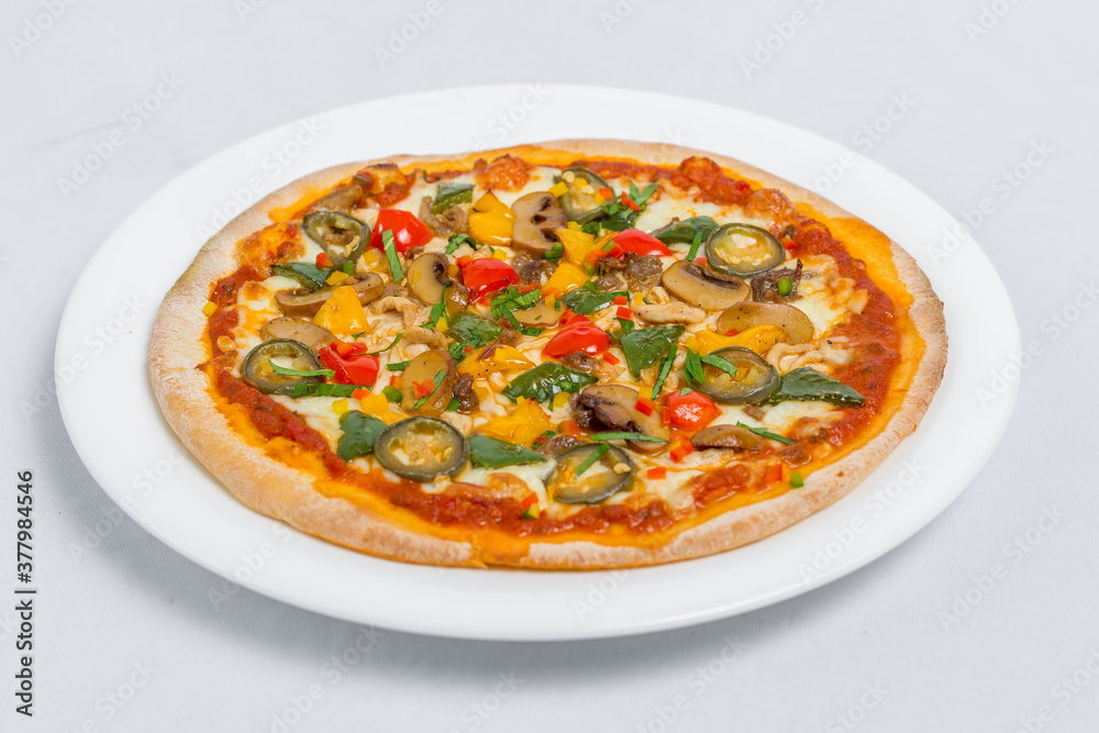 Hot fresh Chicken mushroom jalapeno pizza on white plate isolated white background. Homemade Pizza. Top views.