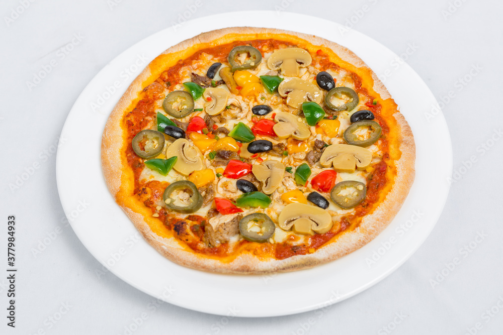 Hot fresh Chicken mushroom jalapeno pizza on white plate isolated white background. Homemade Pizza. Top views.