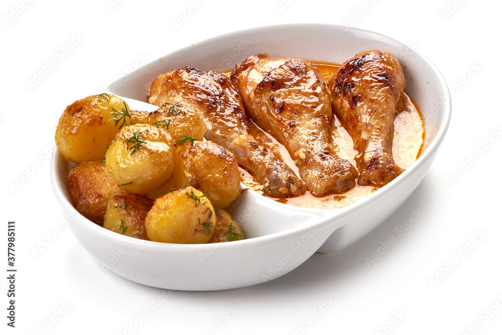 Roasted chicken with baked potaotes, isolated on white background Roasted chicken with baked potaotes, isolated on white background