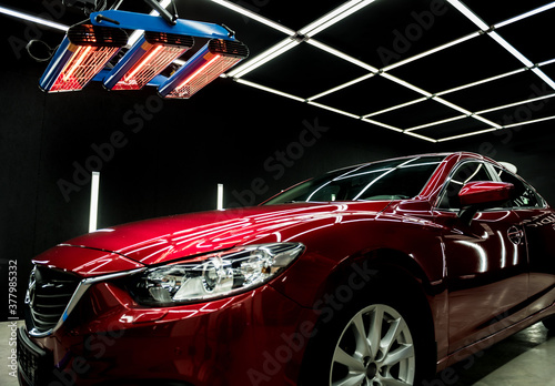 Infrared lamps for drying of car body parts after applying save gloss coating photo