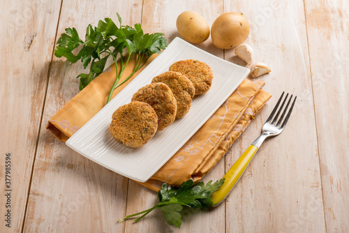 fish croquettes with garlic and potatoes photo