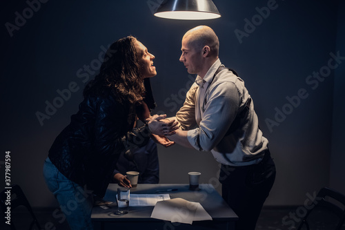 Canvas Print A police investigator beats up an arrested man without witnesses to get a confes