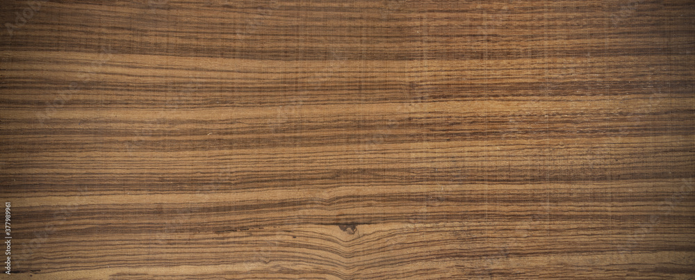 Exotic zebrano wood background. With vignetting