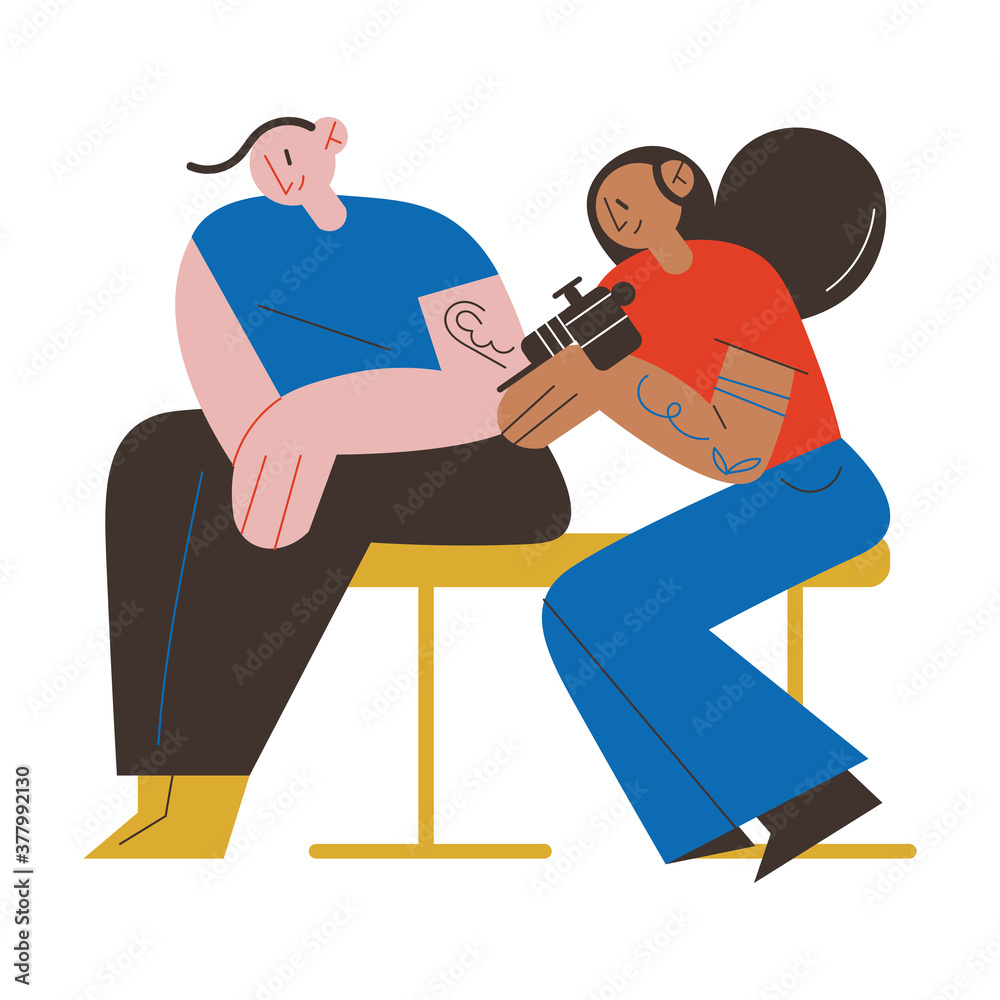 Woman tattoo master sitting and making tatoo on mans hand in tattoo studio